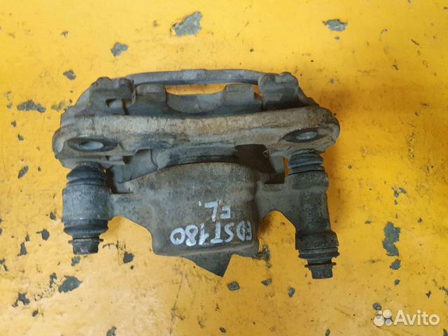 Суппорт тормозной передний левый toyota