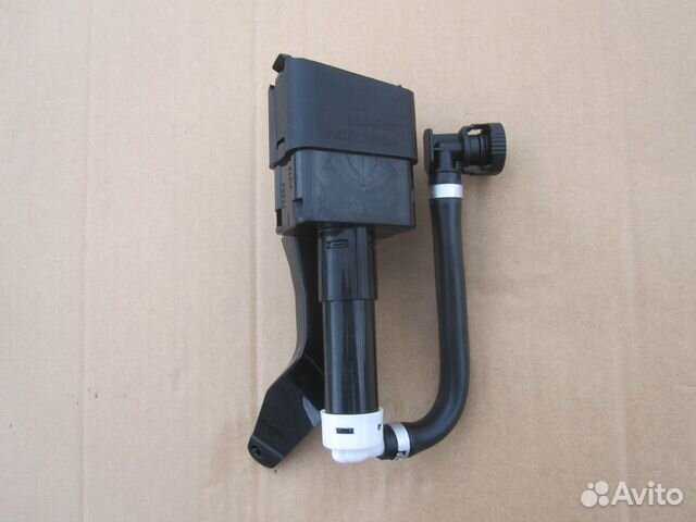 Форсунка омывателя фар левая Mazda CX 7 2007-2009