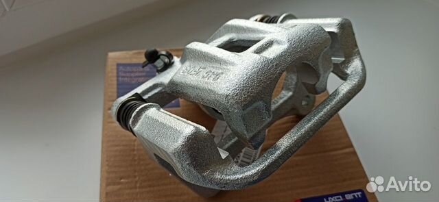 Суппорт тормозной задний левый Шевроле Лачетти